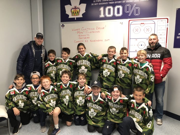 Minor Atom Toronto Marlboros in camo jerseys to honour Remembrance Day.